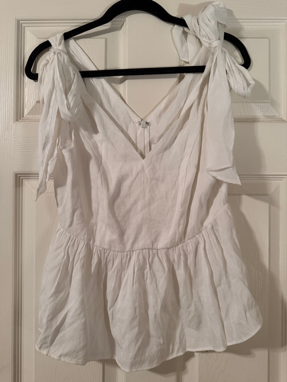 Linen peplum top. V-neck never been worn size medium.
